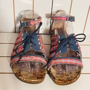 Vibrant Blue and Red Sandals with Crisscross Straps